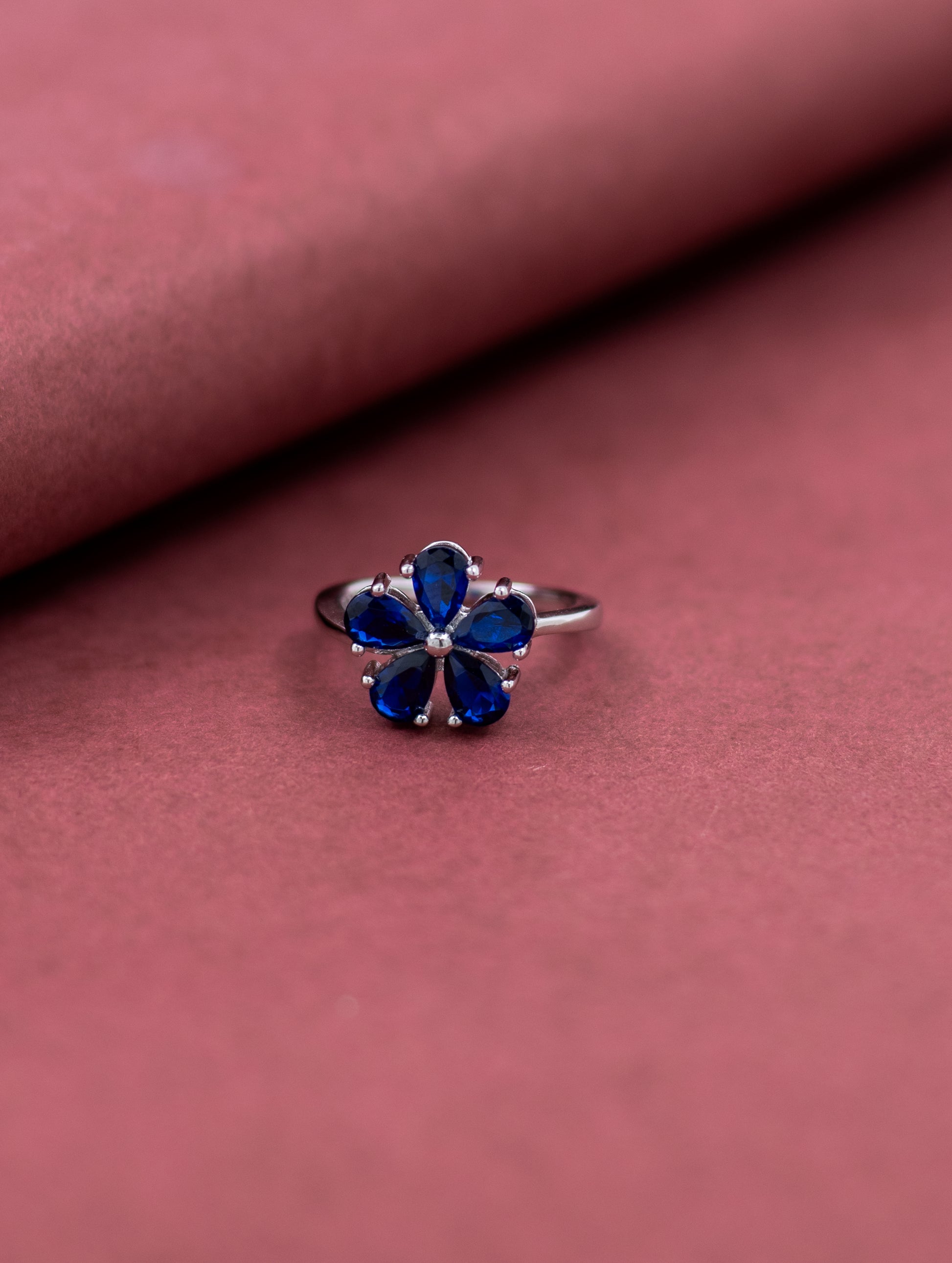 Blue stone floral sterling silver ring
